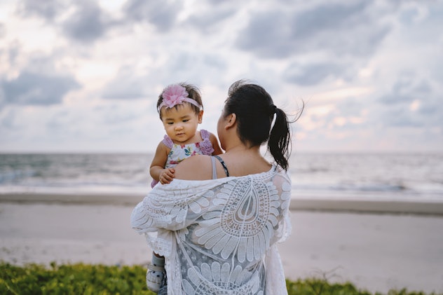 baby girl on beach with mom